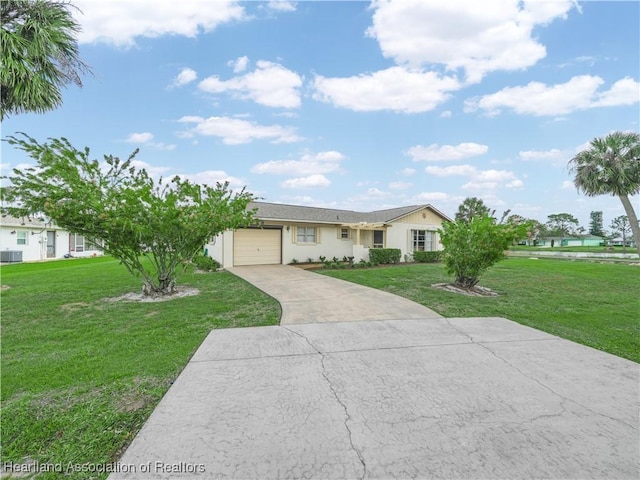 ranch-style house featuring concrete driveway, a front lawn, and an attached garage