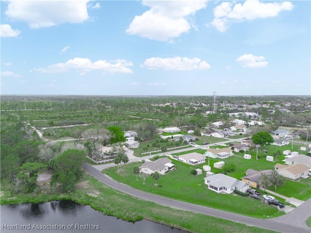 drone / aerial view featuring a residential view and a water view