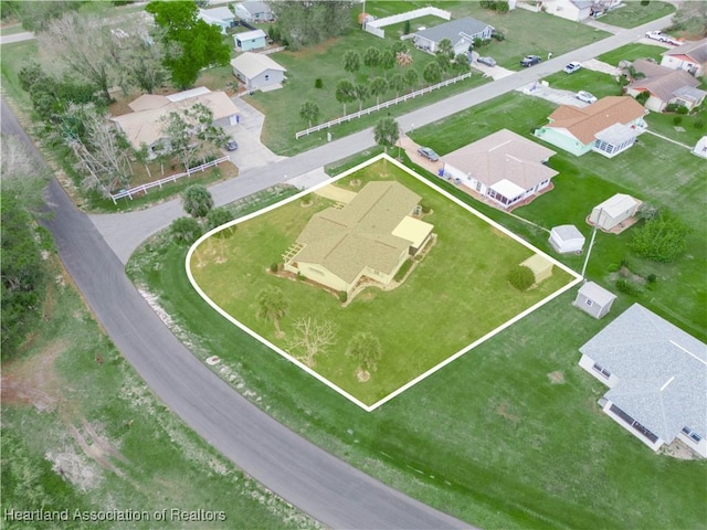 birds eye view of property with a residential view