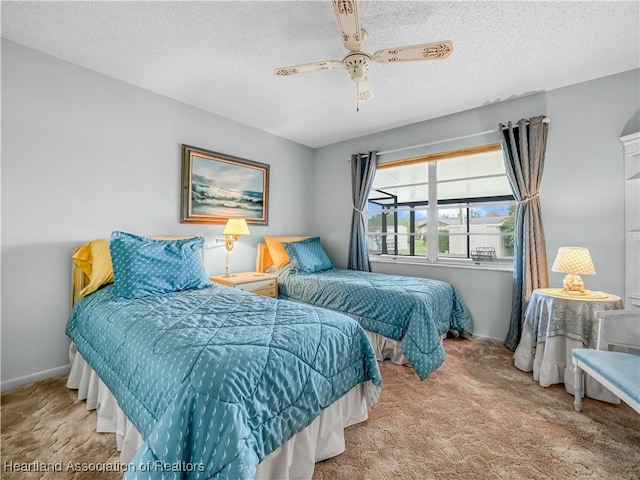 bedroom with light colored carpet, ceiling fan, a textured ceiling, and baseboards