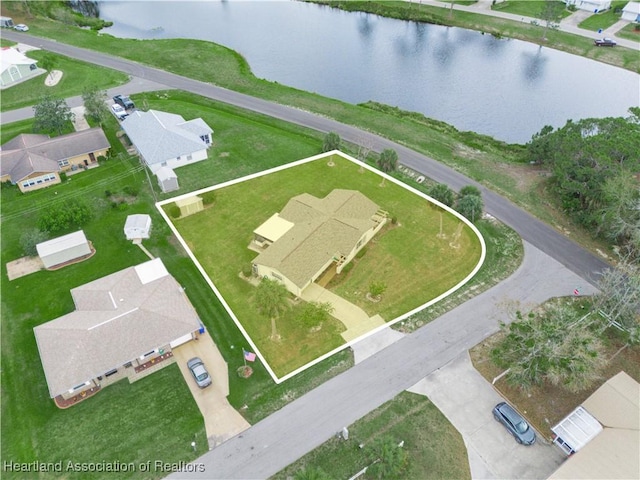 bird's eye view featuring a water view and a residential view