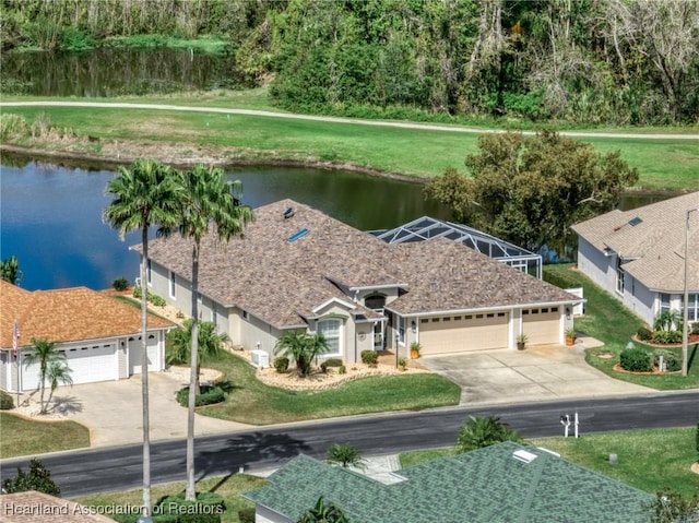 birds eye view of property with a water view