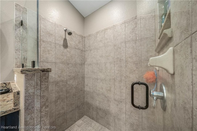 bathroom with a shower with door