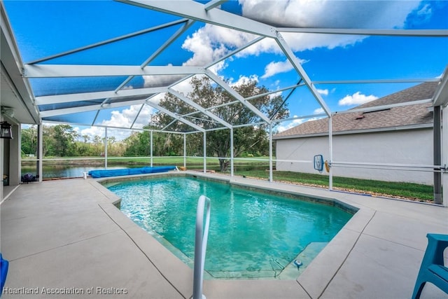 view of swimming pool with a lanai and a patio