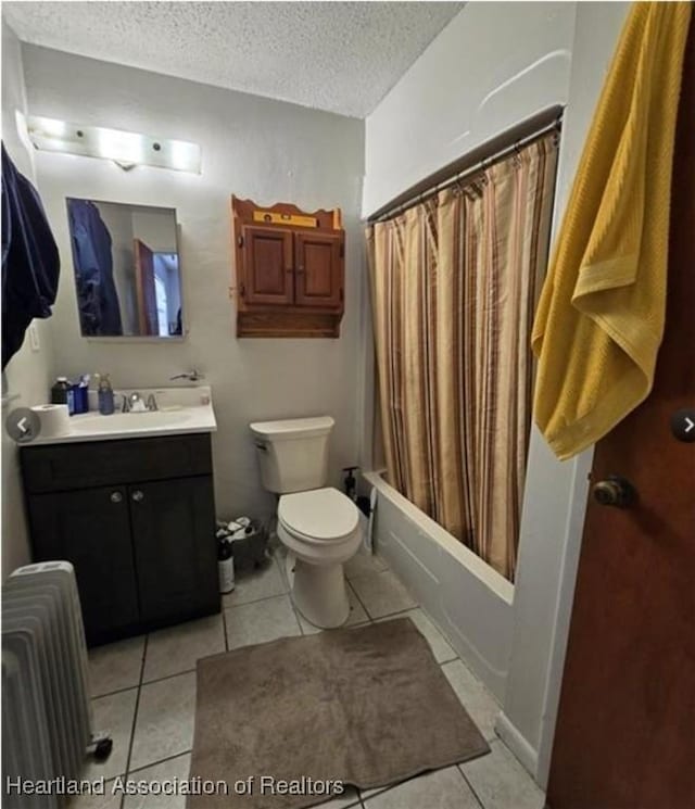 full bathroom with toilet, a textured ceiling, vanity, radiator, and tile patterned flooring