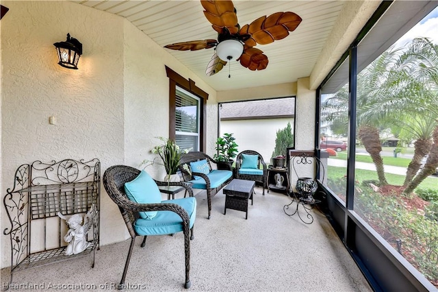 sunroom featuring ceiling fan and a healthy amount of sunlight