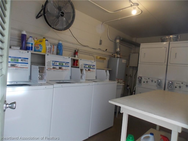 laundry room with washer and clothes dryer, gas water heater, and stacked washer and clothes dryer