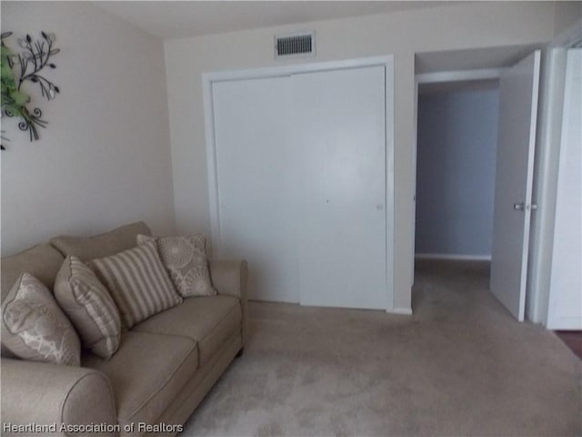 living room featuring light carpet