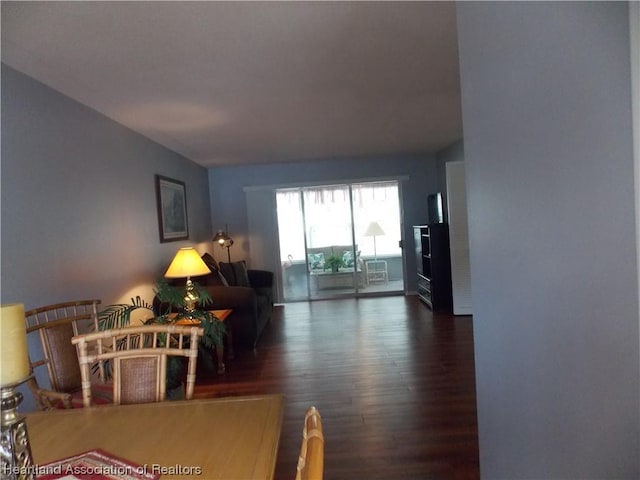 living room with dark hardwood / wood-style floors