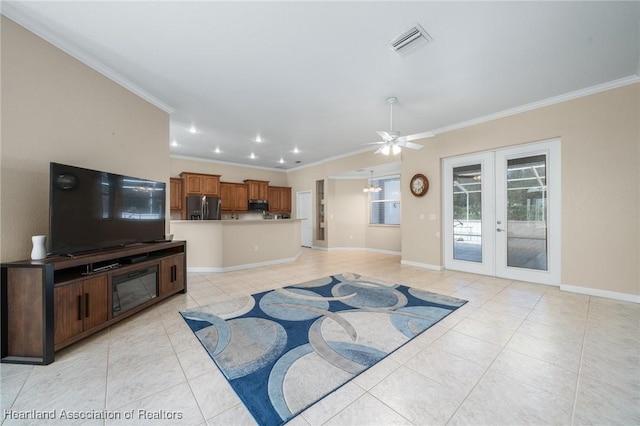 living room featuring ceiling fan, french doors, and ornamental molding