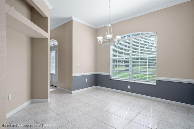 tiled empty room with a chandelier, plenty of natural light, and crown molding