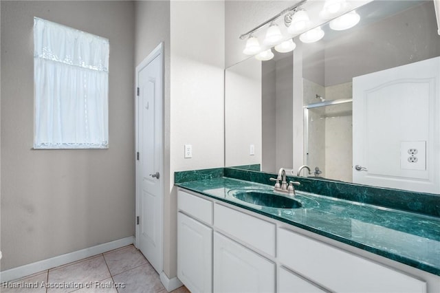 bathroom featuring tile patterned floors, vanity, and an enclosed shower