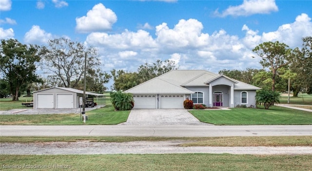 ranch-style house with a carport, a garage, and a front lawn