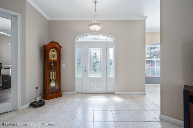 entryway featuring light tile patterned flooring and ornamental molding