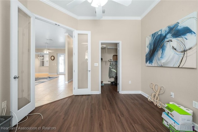 interior space featuring french doors, dark hardwood / wood-style flooring, ceiling fan, and ornamental molding