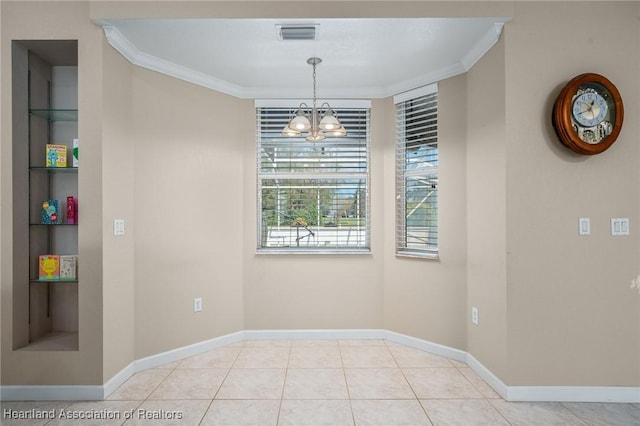 dining space featuring built in shelves, light tile patterned floors, ornamental molding, and an inviting chandelier