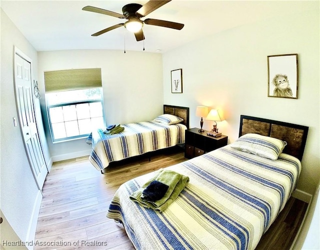 6978 Mexican Hat Dr, Sebring, FL 33872 - bedroom featuring light wood finished floors and ceiling fan