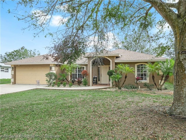 ranch-style house featuring a garage and a front lawn