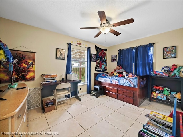 tiled bedroom with ceiling fan