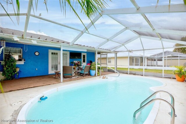 4231 Leaf Rd, Sebring, FL 33875 - outdoor pool featuring glass enclosure and a patio