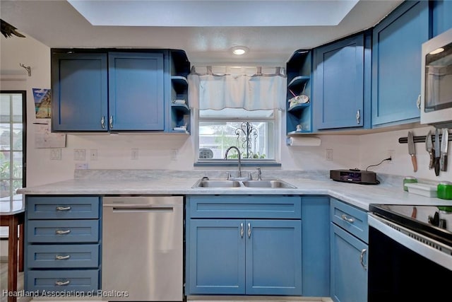 4231 Leaf Rd, Sebring, FL 33875 - kitchen with blue cabinetry, a sink, open shelves, and appliances with stainless steel finishes