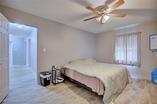 bedroom featuring ceiling fan and light wood-type flooring