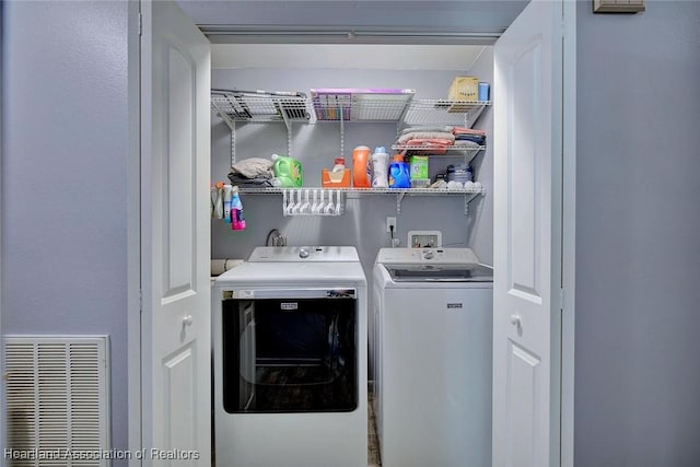 laundry area with washing machine and dryer