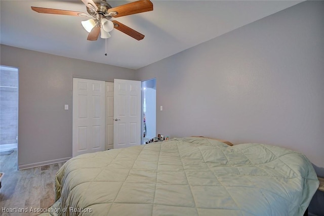 bedroom featuring ceiling fan and light hardwood / wood-style flooring