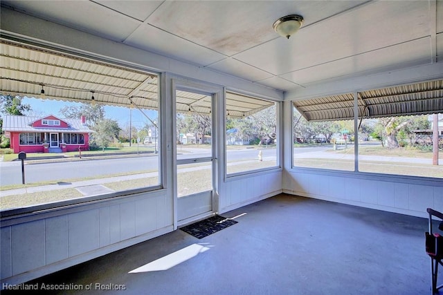 unfurnished sunroom featuring plenty of natural light