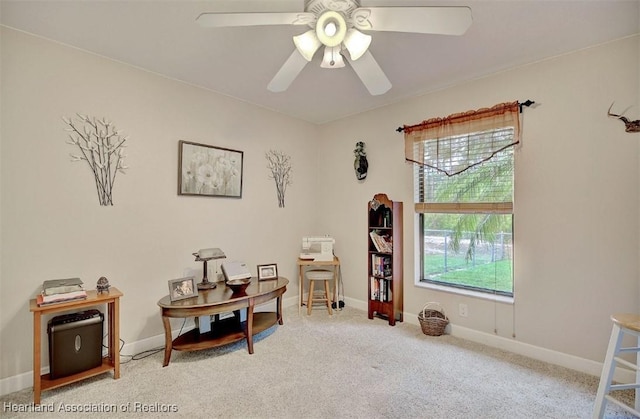 miscellaneous room featuring a wealth of natural light, ceiling fan, and light carpet