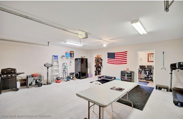 interior space featuring black fridge and a garage door opener