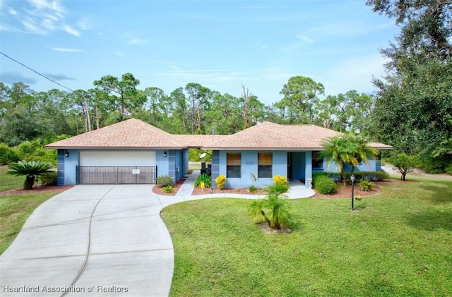 ranch-style home with a front lawn and a garage