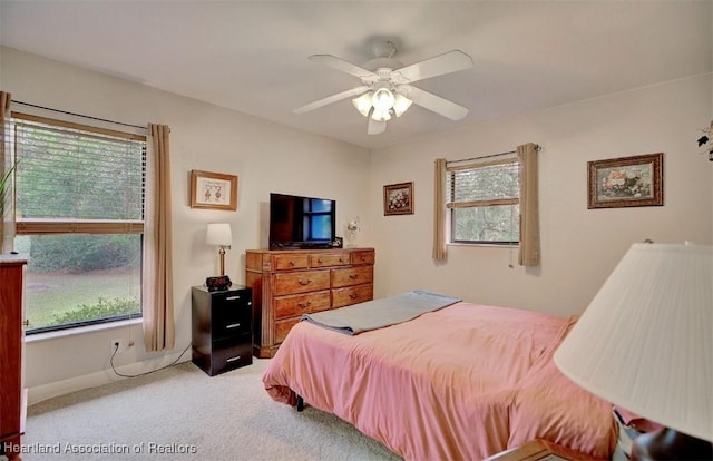 carpeted bedroom featuring ceiling fan