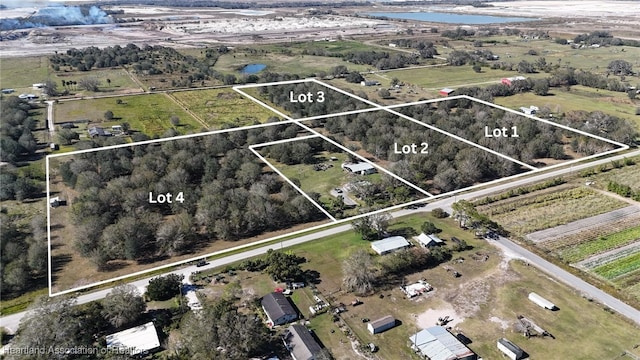 aerial view with a water view and a rural view