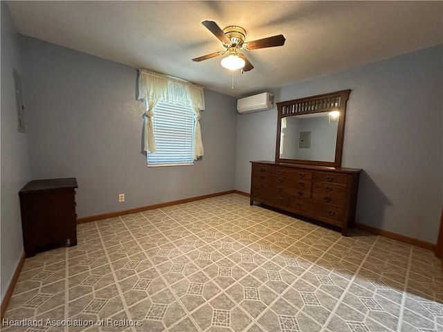 unfurnished bedroom featuring ceiling fan, a wall mounted air conditioner, and electric panel