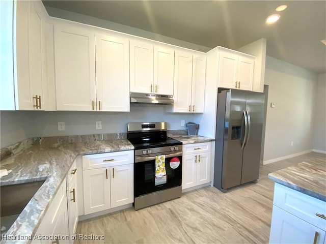 kitchen featuring white cabinets, light stone counters, sink, and stainless steel appliances