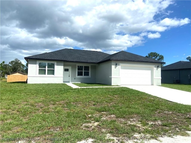 view of front of house with a garage and a front yard