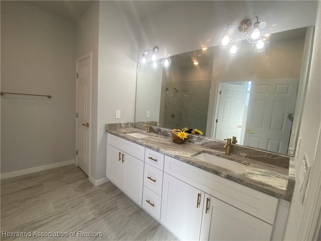 bathroom with vanity and a shower with shower door