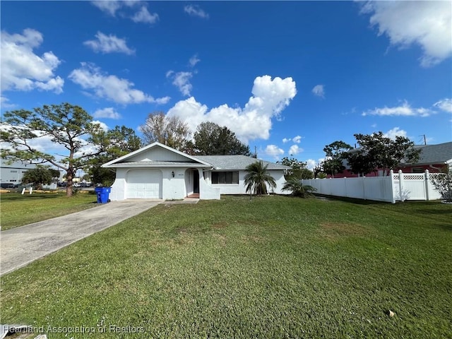 single story home featuring a garage, a front yard, concrete driveway, and fence