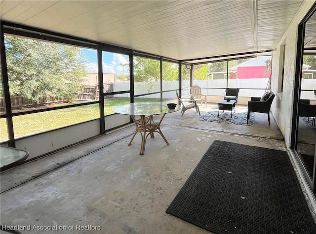 unfurnished sunroom with a healthy amount of sunlight