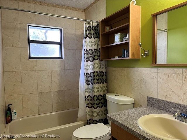 full bathroom with toilet, shower / bath combination with curtain, tile walls, and vanity