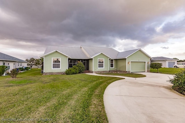 single story home with a front yard and a garage