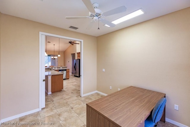 home office featuring lofted ceiling and a notable chandelier