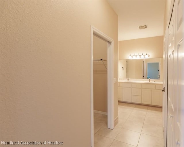 bathroom with vanity and tile patterned floors