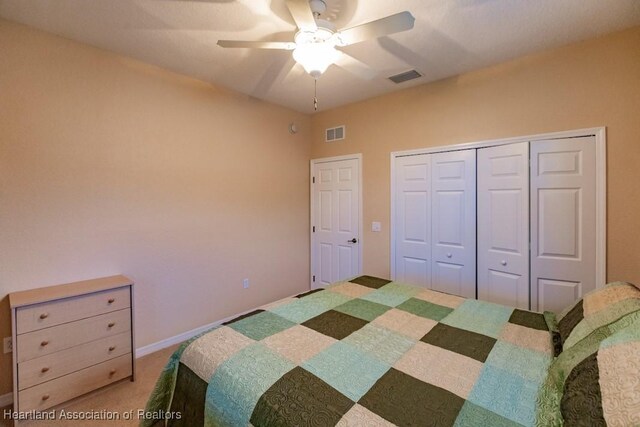 bedroom with carpet floors, a closet, and ceiling fan