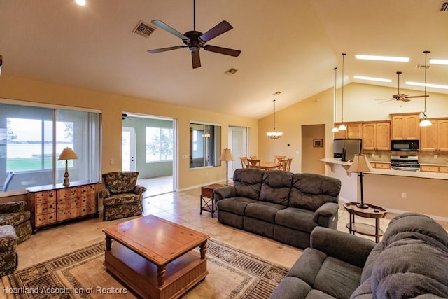 tiled living room with high vaulted ceiling and ceiling fan