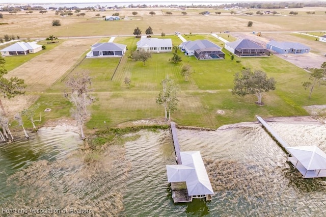 drone / aerial view featuring a water view and a rural view