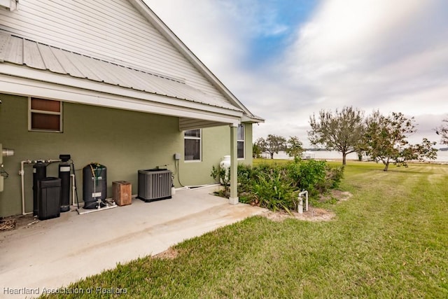 view of yard with cooling unit and a patio area