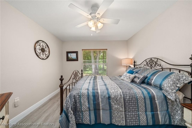 2036 Ashley Oaks Cir, Sebring, FL 33870 - bedroom with wood finished floors, baseboards, and a ceiling fan
