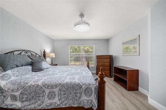 2036 Ashley Oaks Cir, Sebring, FL 33870 - bedroom with light wood finished floors and baseboards